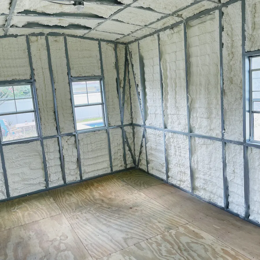 Closed-cell spray foam insulation applied to wall cavities in a residential project in Syracuse